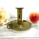 Brass candlestick with rise and fall