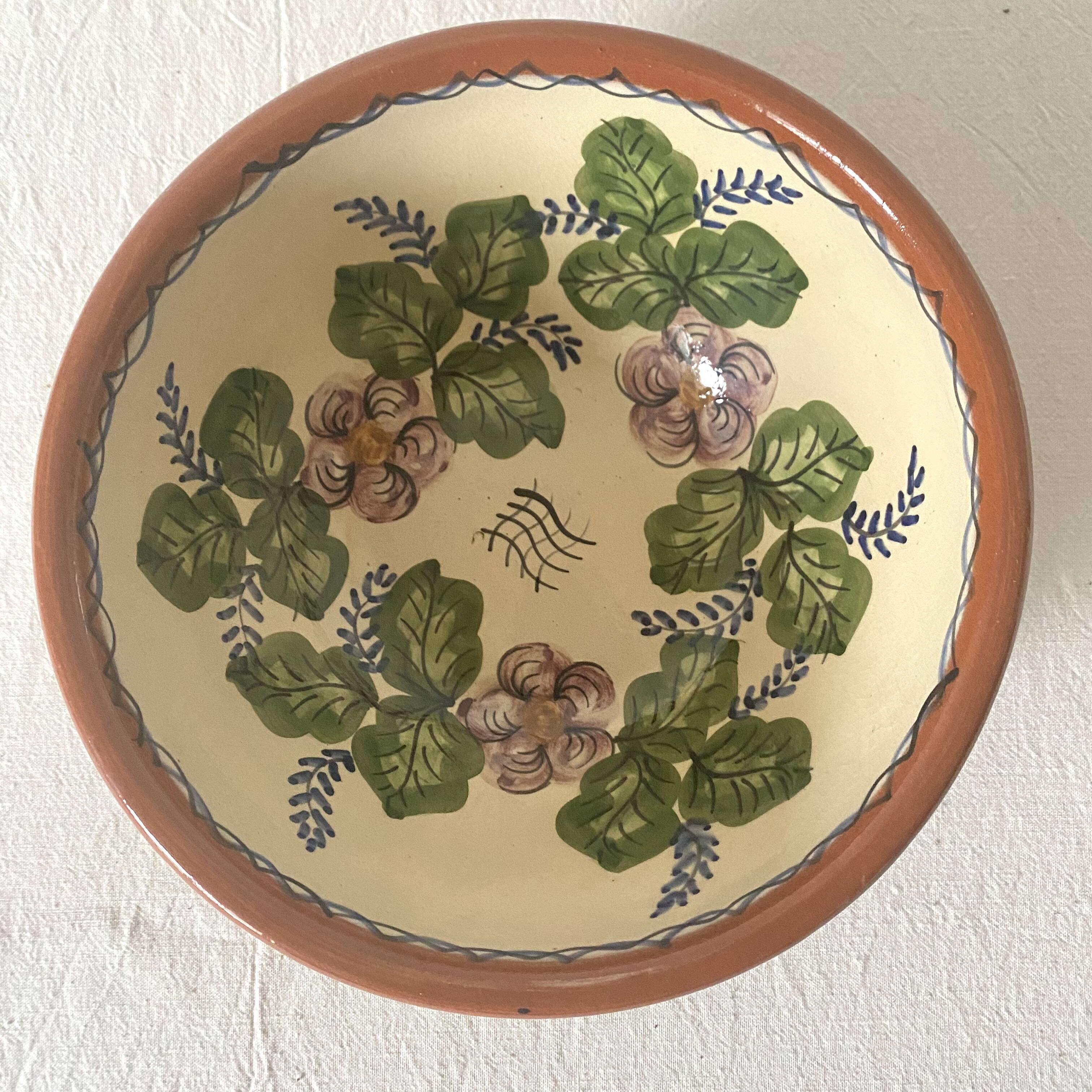 Terracotta salad bowl with flower decoration