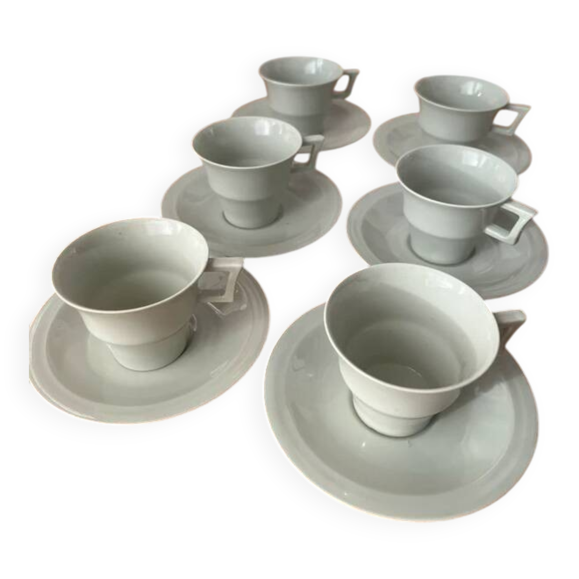 Art Deco cups and saucers by Théodore Haviland in celadon.