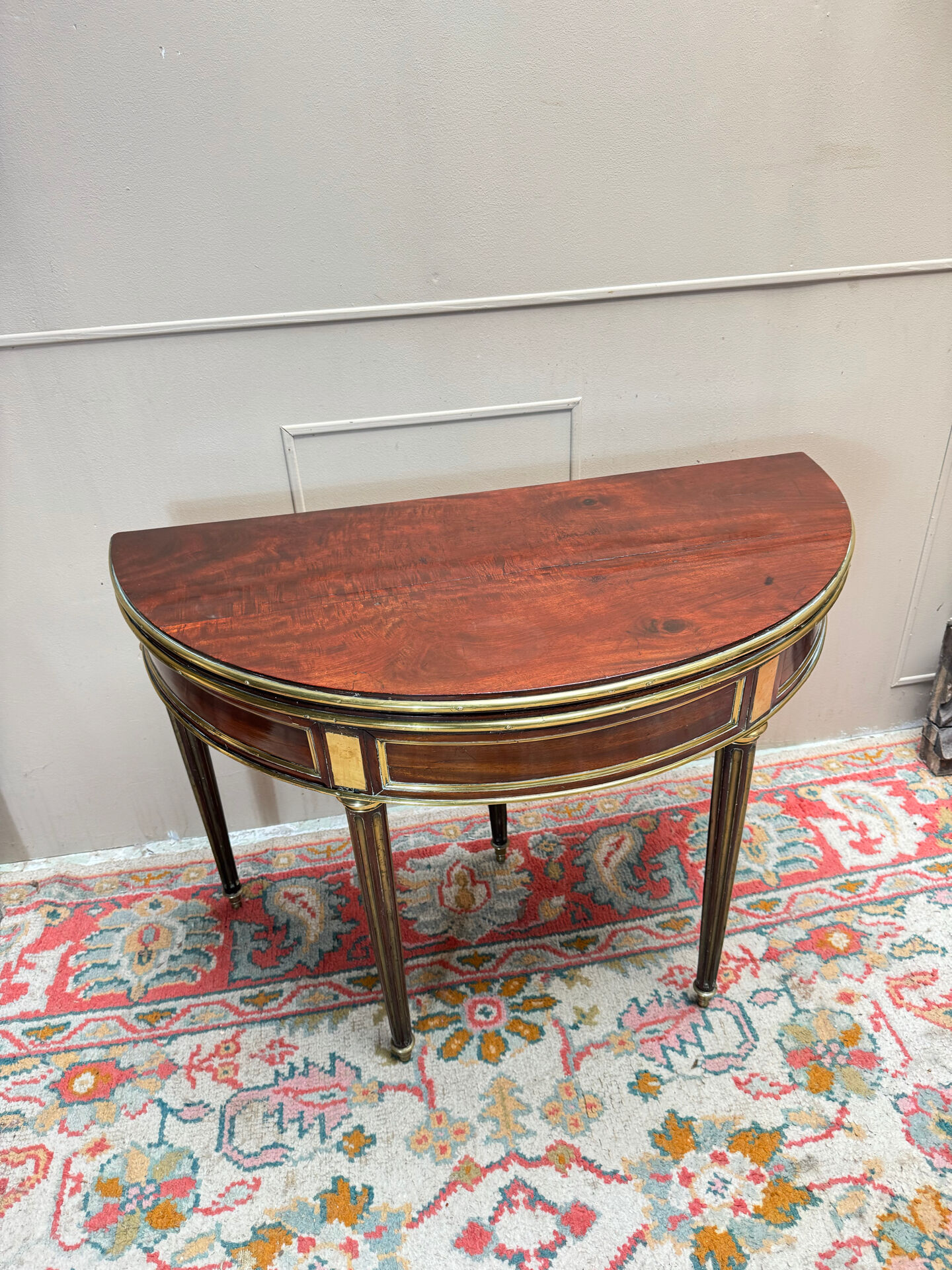 Half-moon table in mahogany from the Louis XVI period, 18th century.