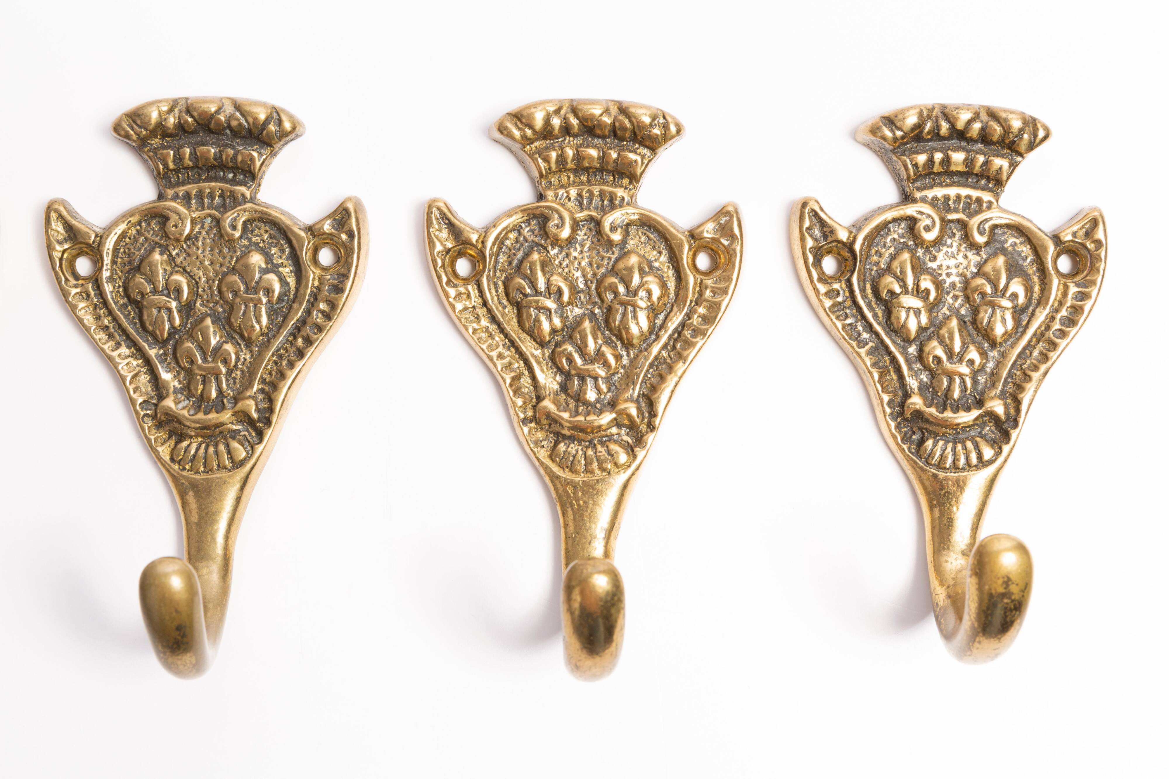 Set of four decorative vintage gold wall hooks, Europe, 1960s.