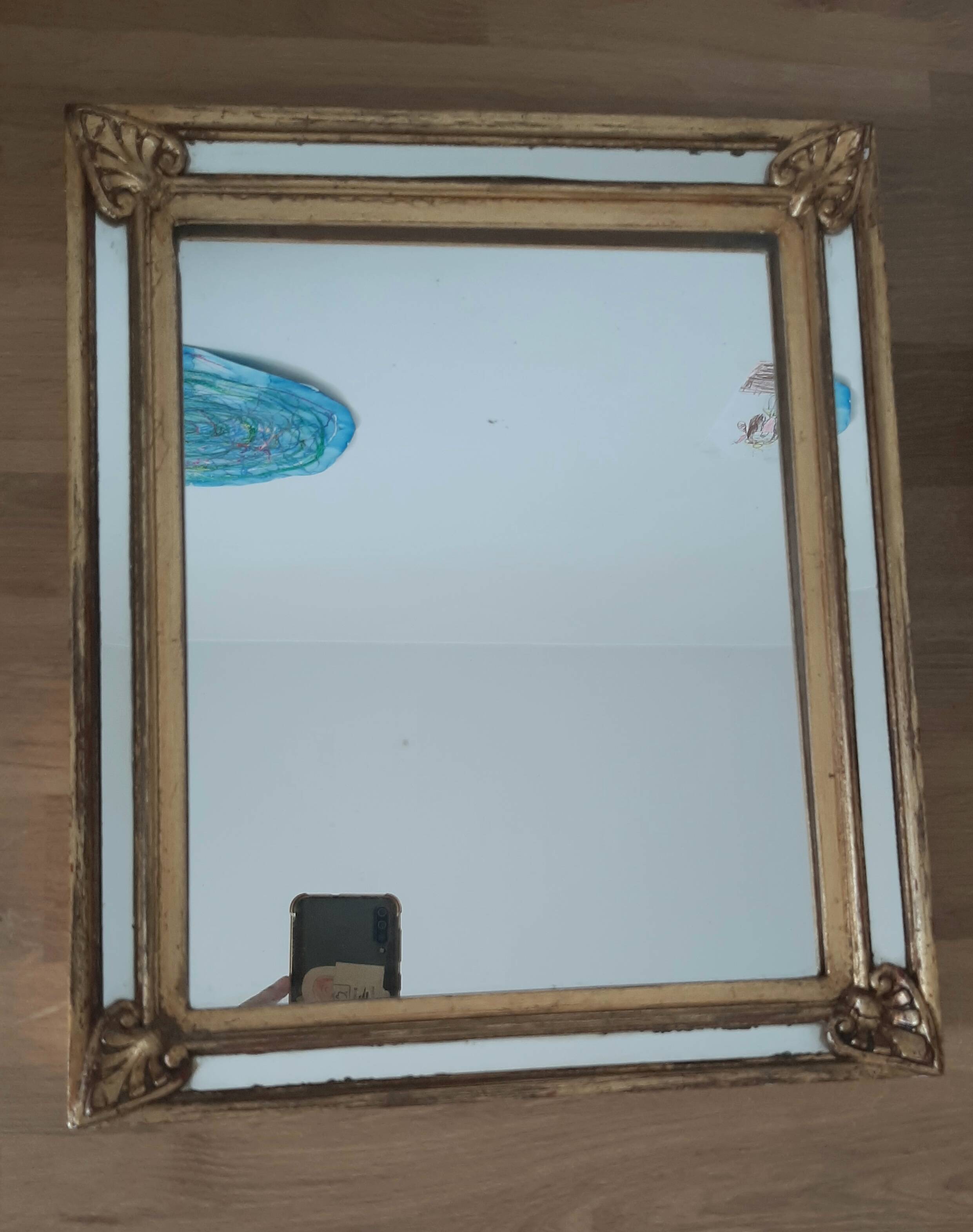 Gold-framed mirror