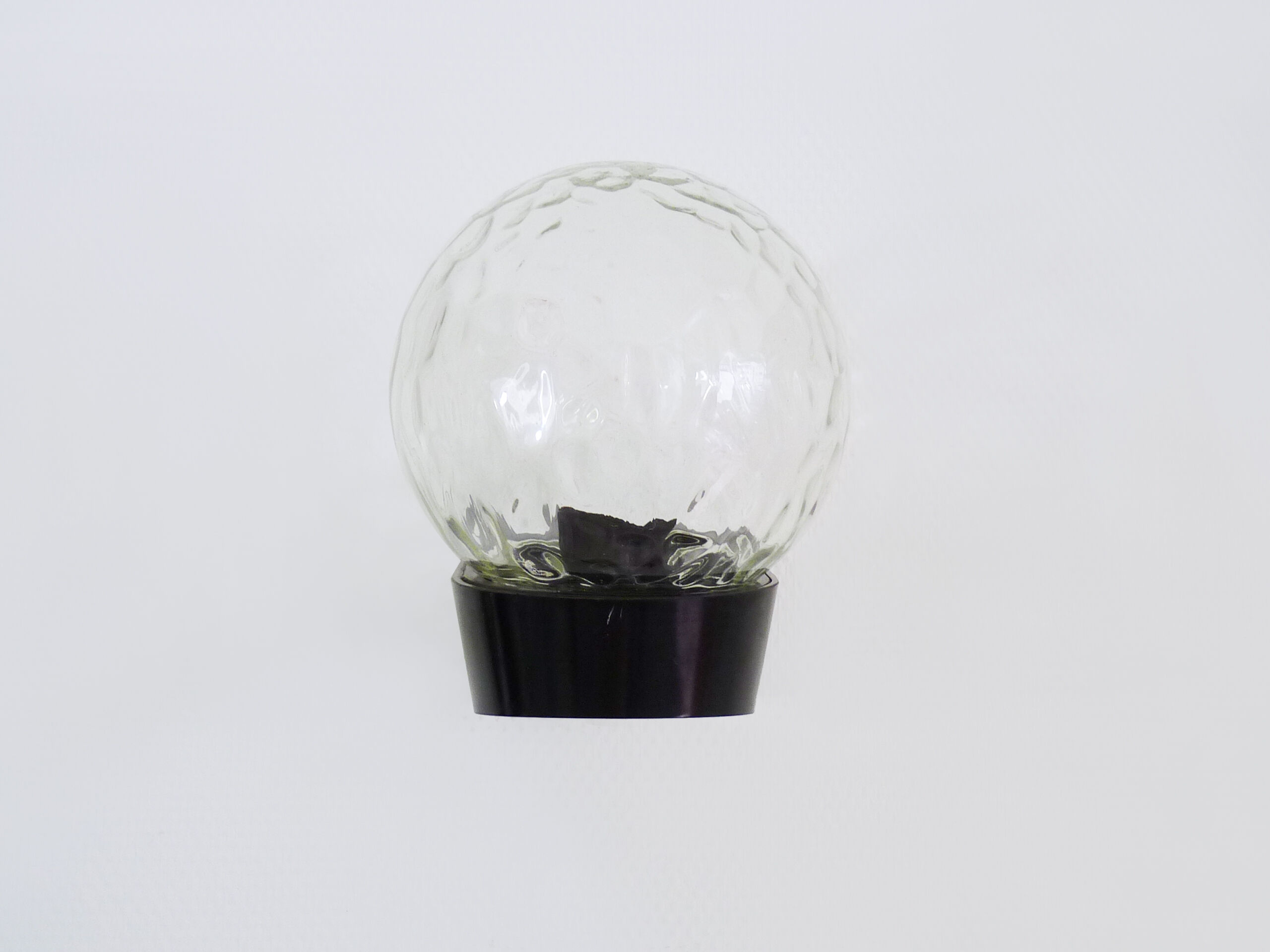 Vintage wall light plastic or bakelite structure, transparent glass globe. Year 70
