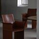 Set of 4 brown/red leather armchairs, Tito Agnoli, modern Italian, 1970s.