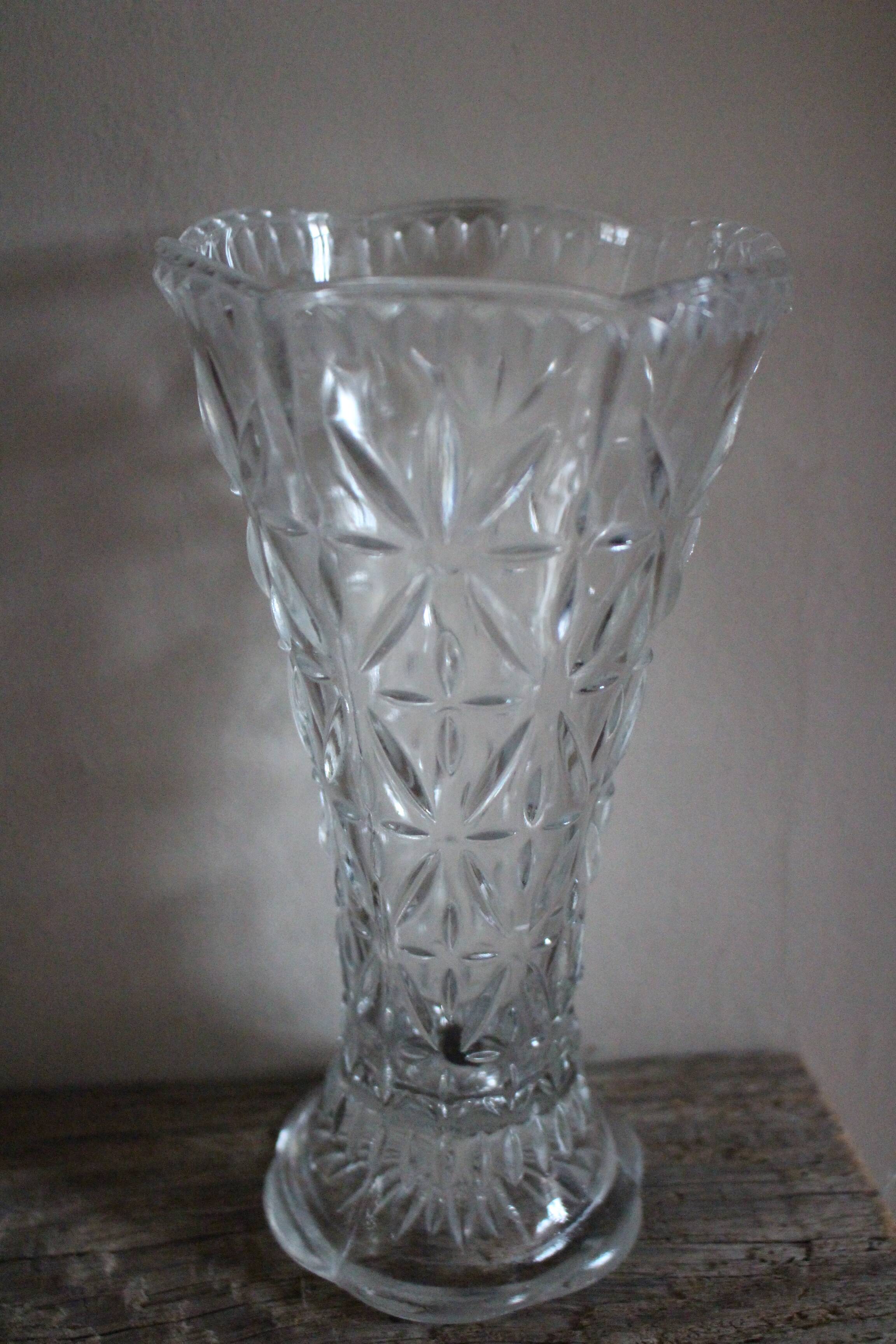 Transparent carved glass vase flowers