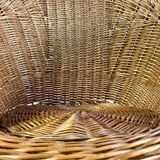 High-backed chair or shepherdess in vintage wicker