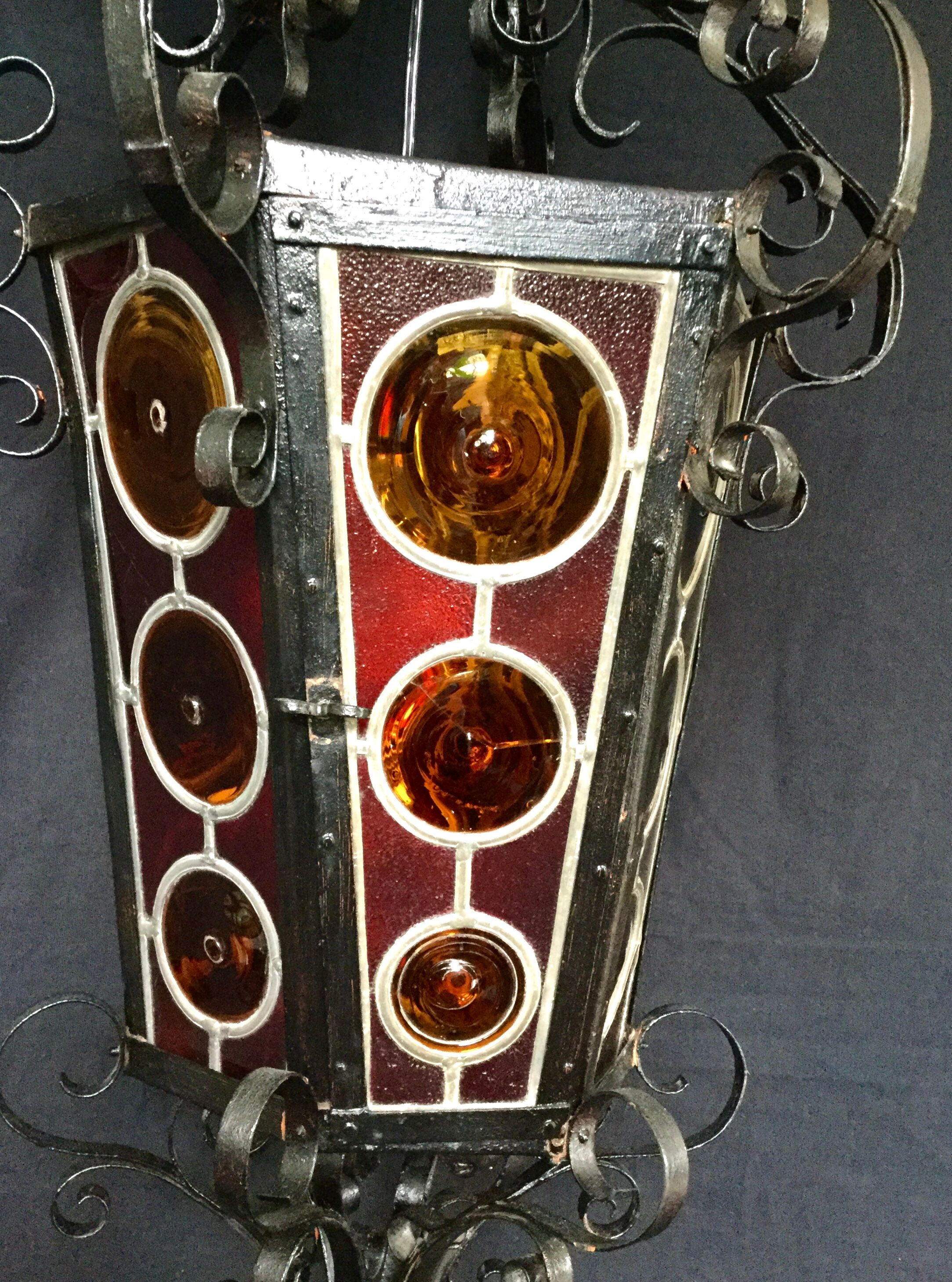 Wrought iron lantern and stained glass windows