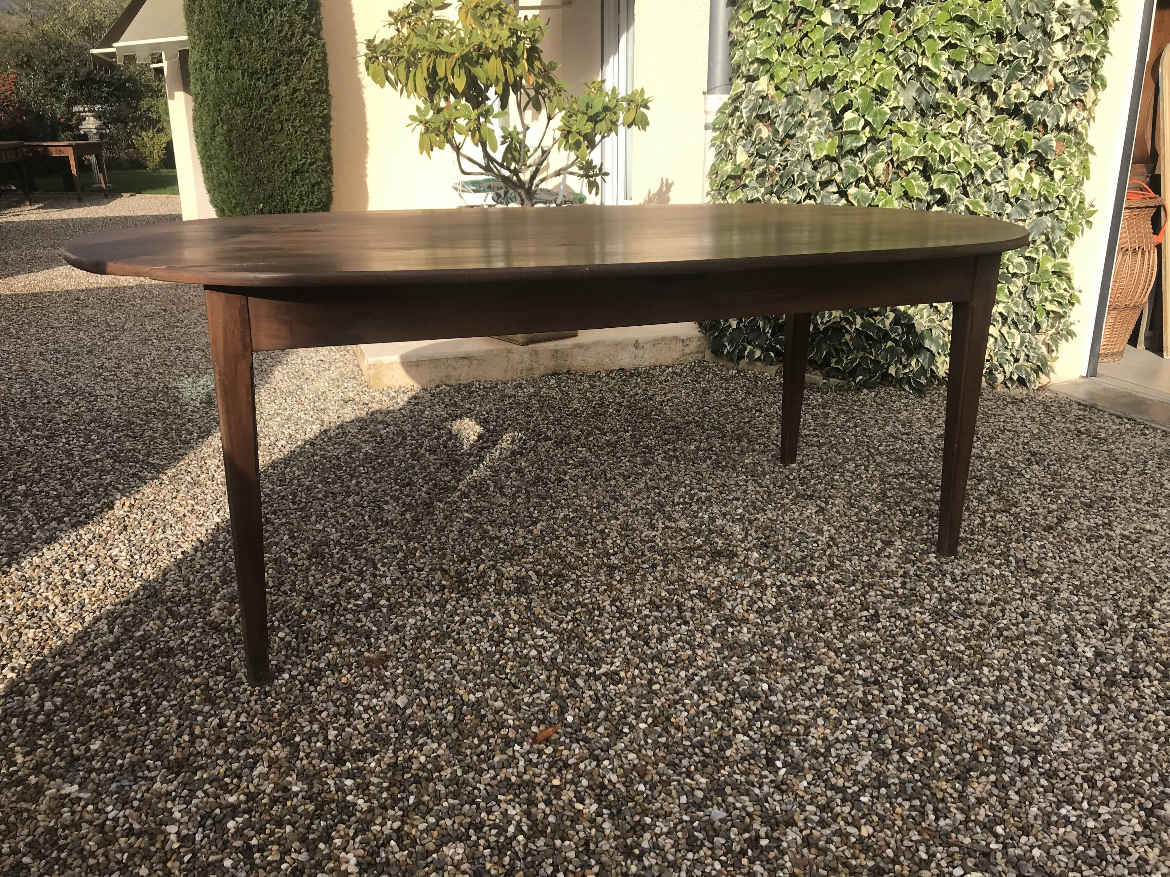 Oval farm table in massive walnut