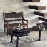 Small antique Indonesian bench in carved teak with plant and floral motifs.