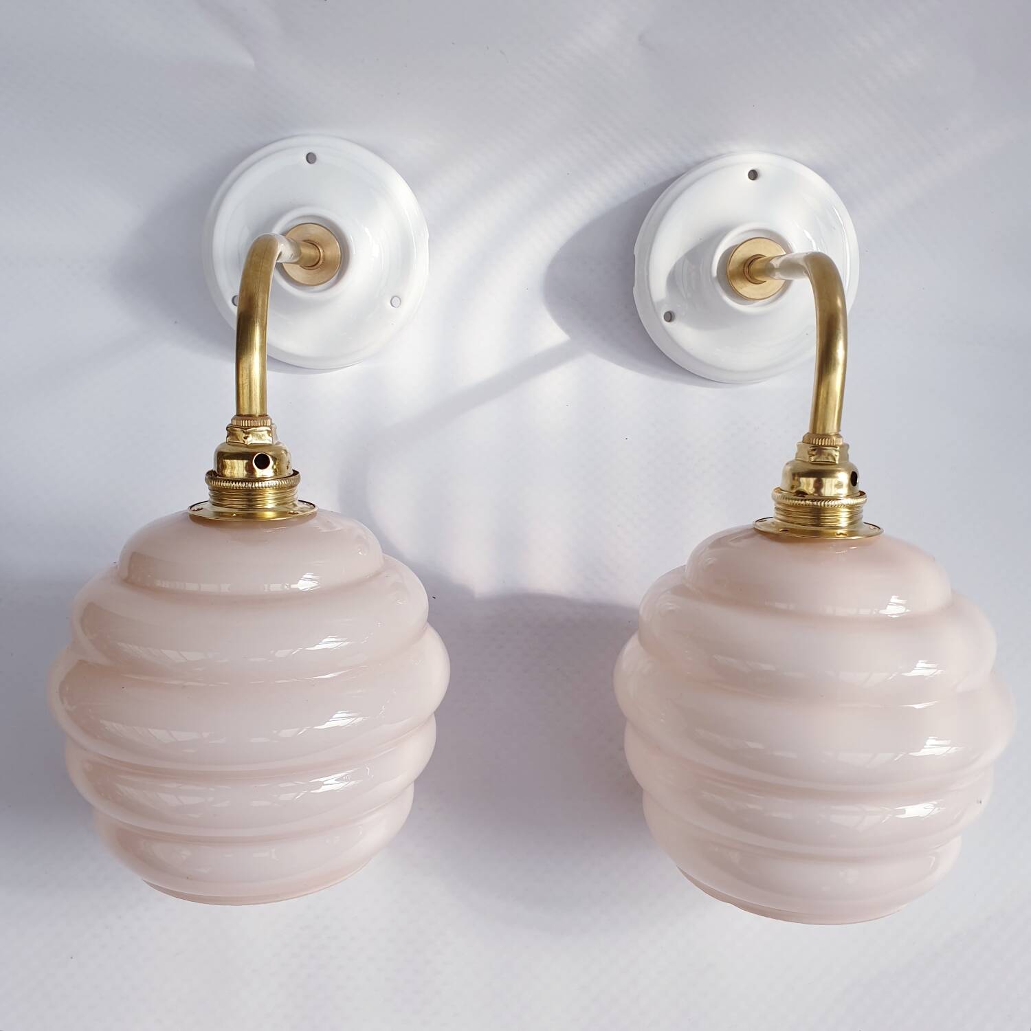 Swan neck and glass globe wall lights