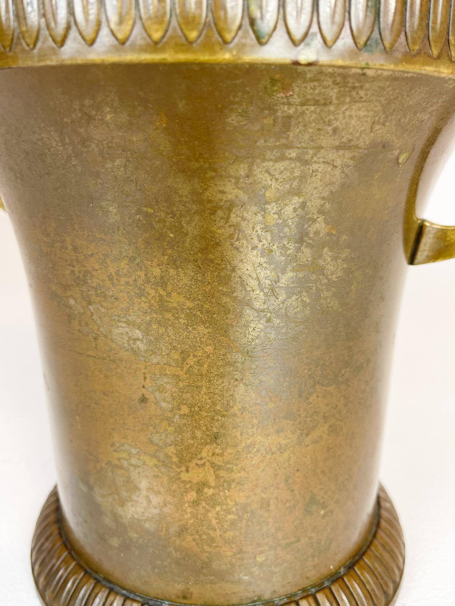 Art Deco champagne cooler in copper and brass with relief patterns, Sweden, 1930s.