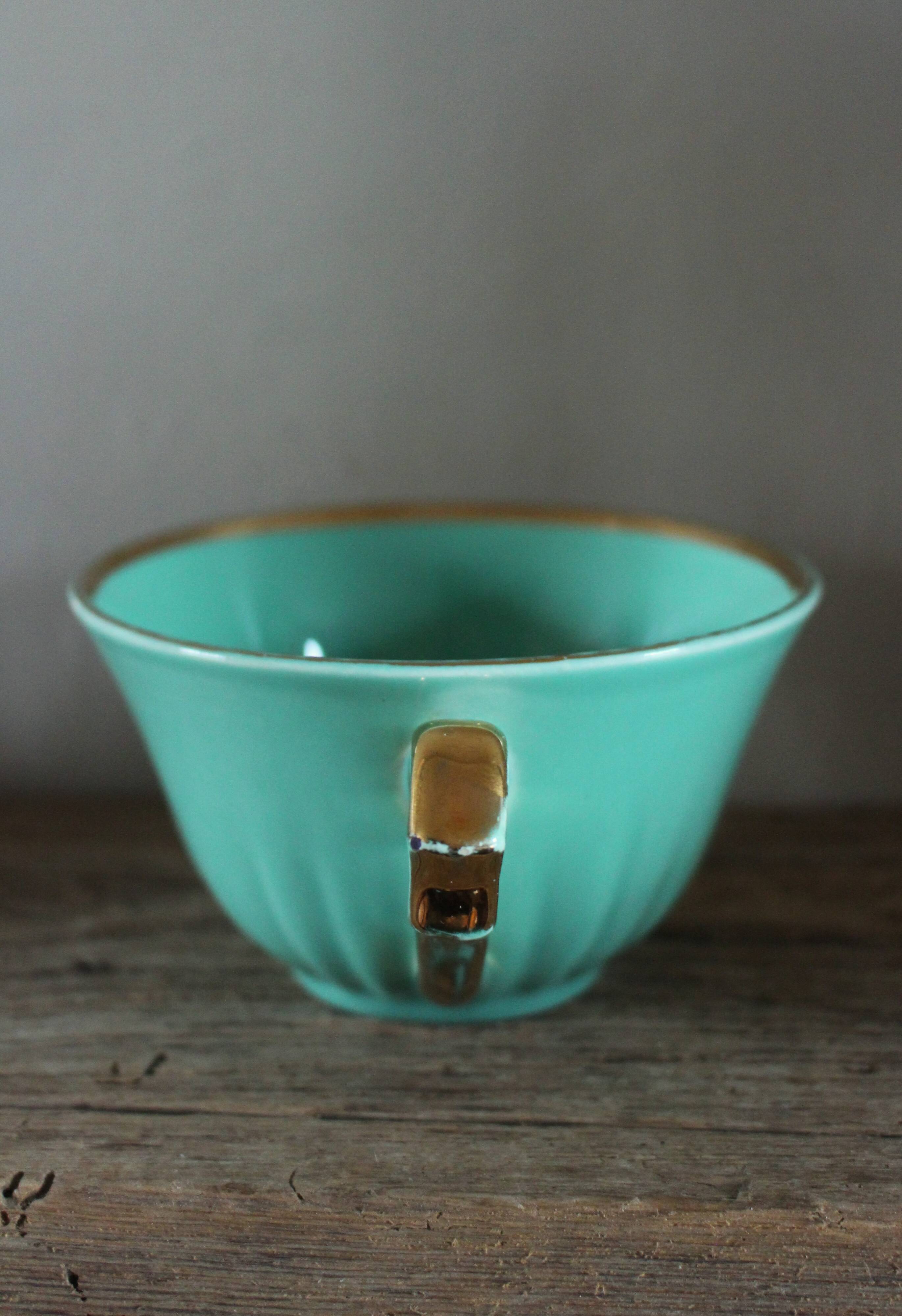Green and gold cup from the Moi Salins collection.