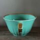 Green and gold cup from the Moi Salins collection.