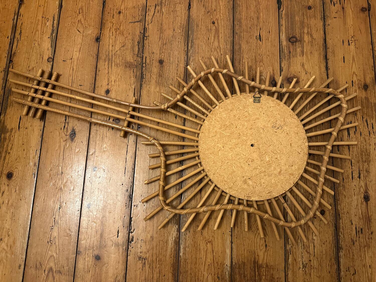 Vintage guitar-shaped rattan mirror