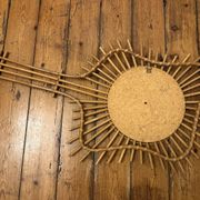 Vintage guitar-shaped rattan mirror