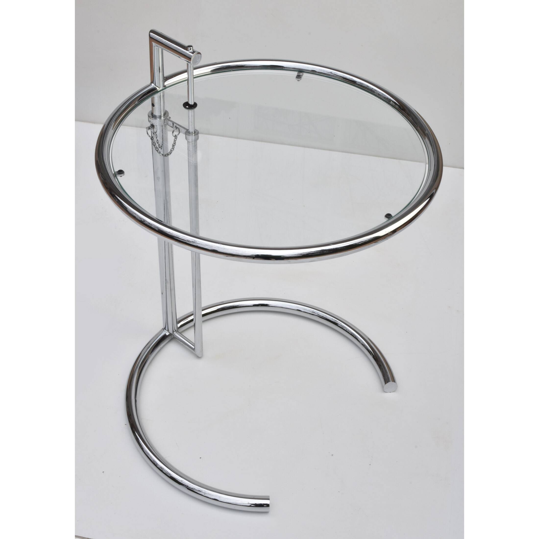 Adjustable height side table in the style of Eileen Gray.