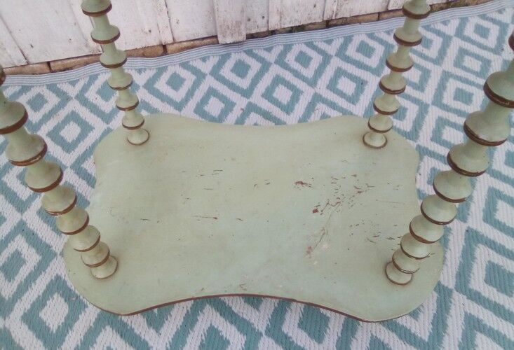 Shelf coils monogrammed patinated wood