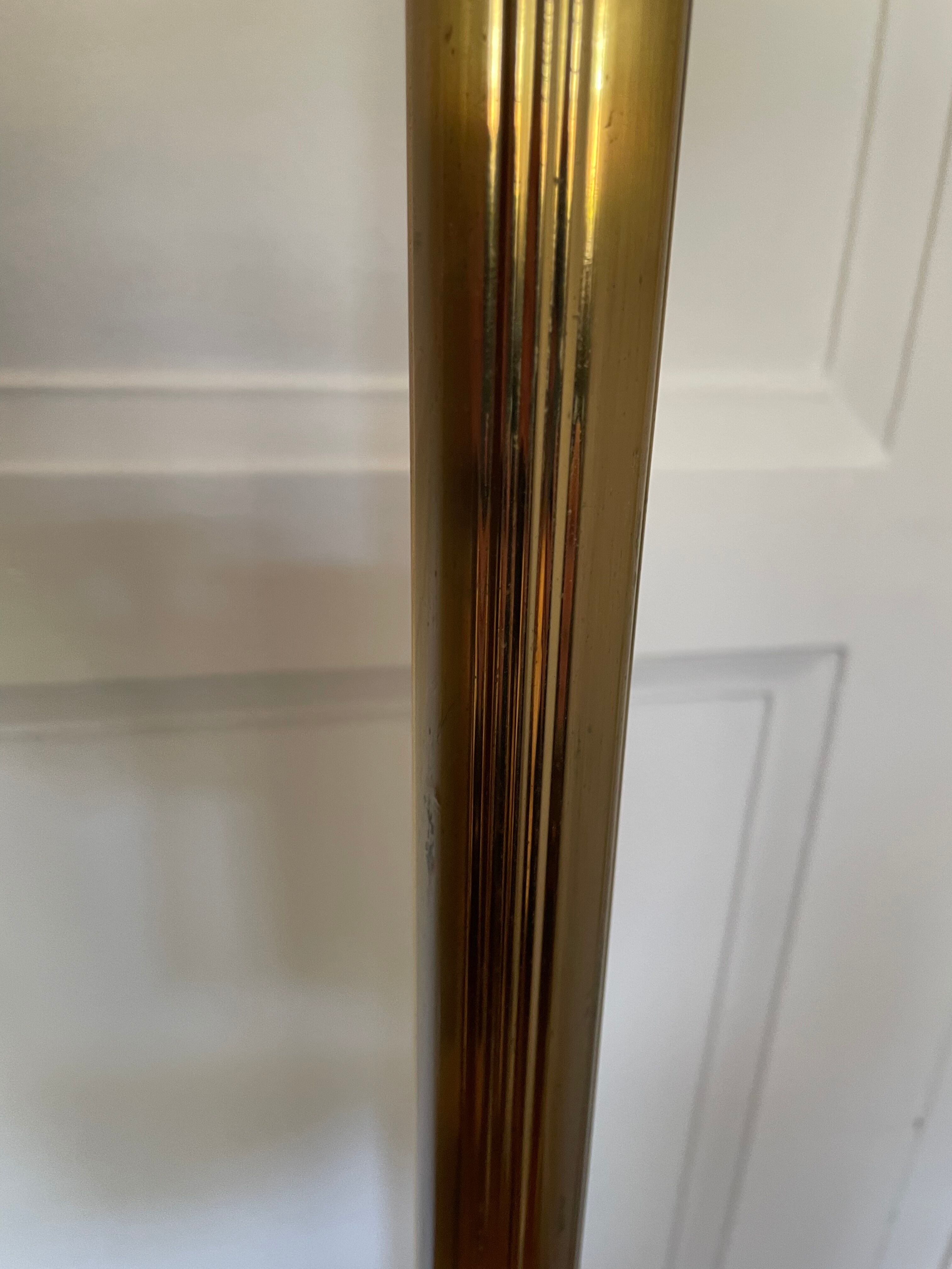 Articulated brass and gold metal floor lamp