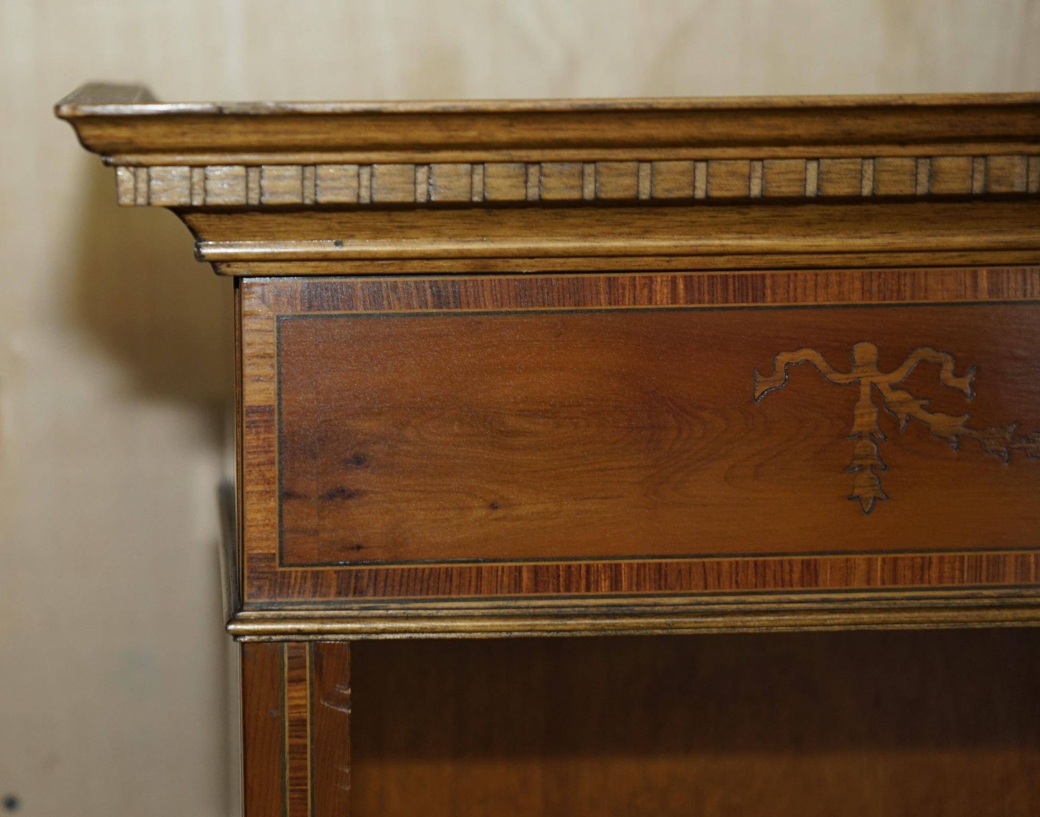 Pair of Sheraton Revival bookcases in satinwood, walnut, and yew.