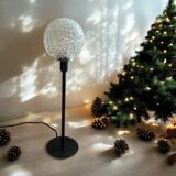 Table lamp with an antique textured glass globe