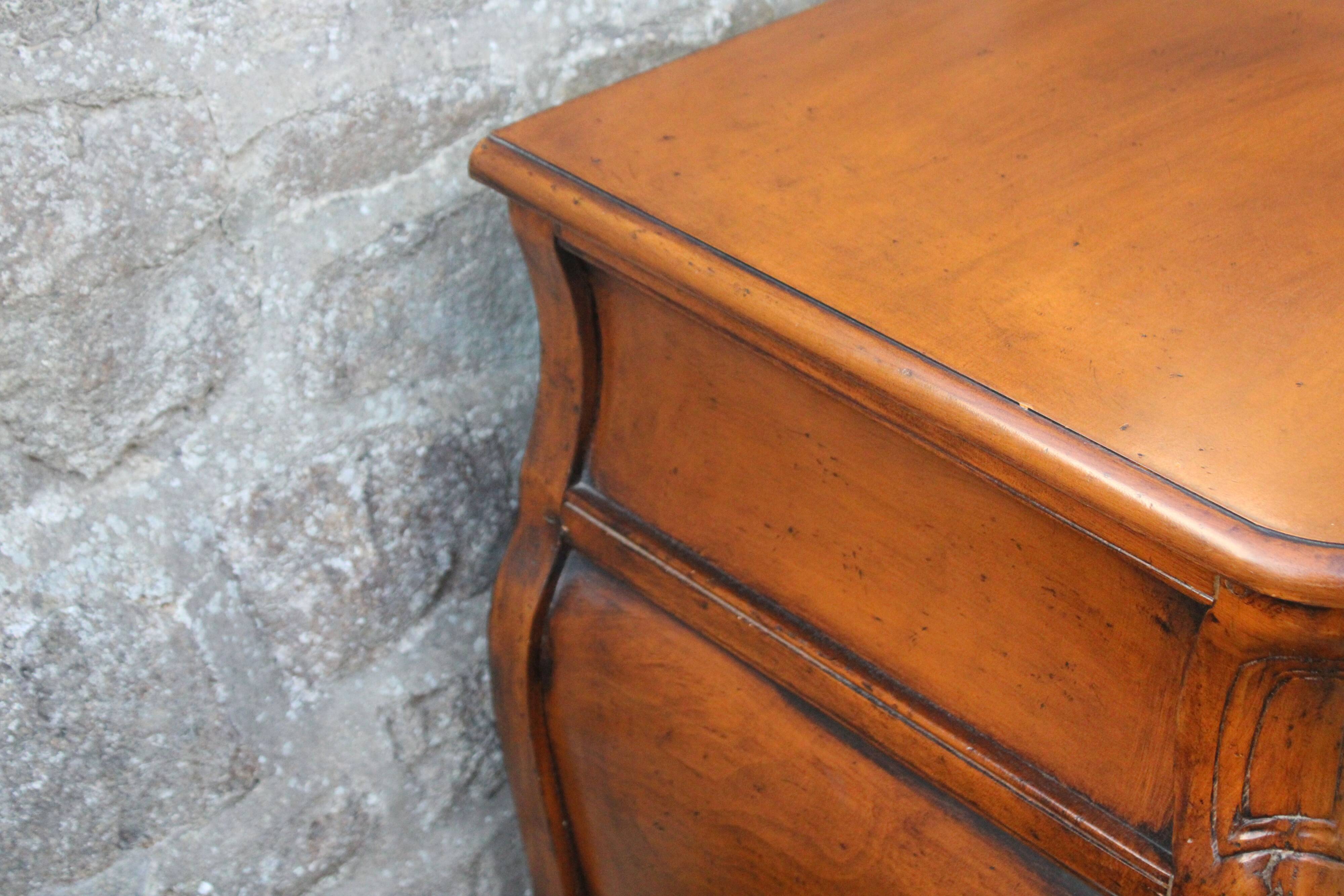 Curved Louis XV style chest of drawers known as a “tomb”