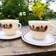 Two vintage opaline glass cups/saucers JAJ Pyrex England.