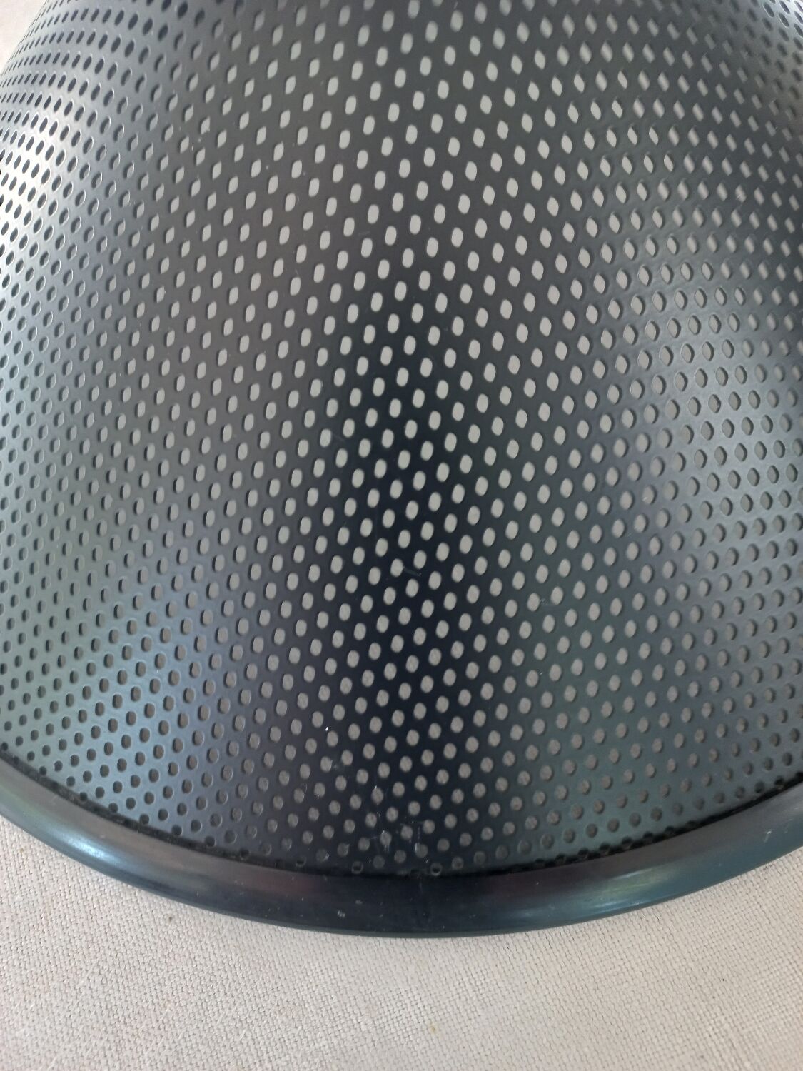 Black perforated metal day abatement