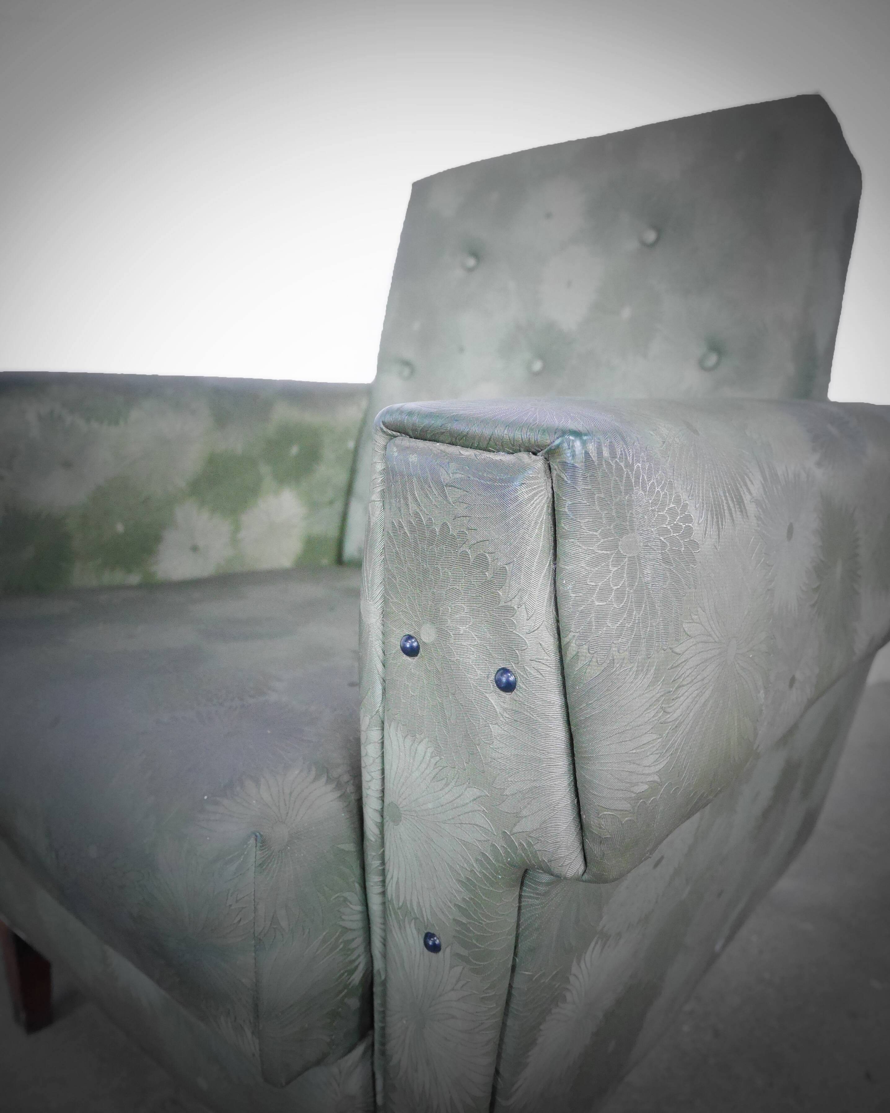 Green armchair in leatherette