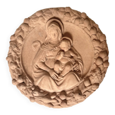 Wall medallion of the Virgin and Child in terracotta