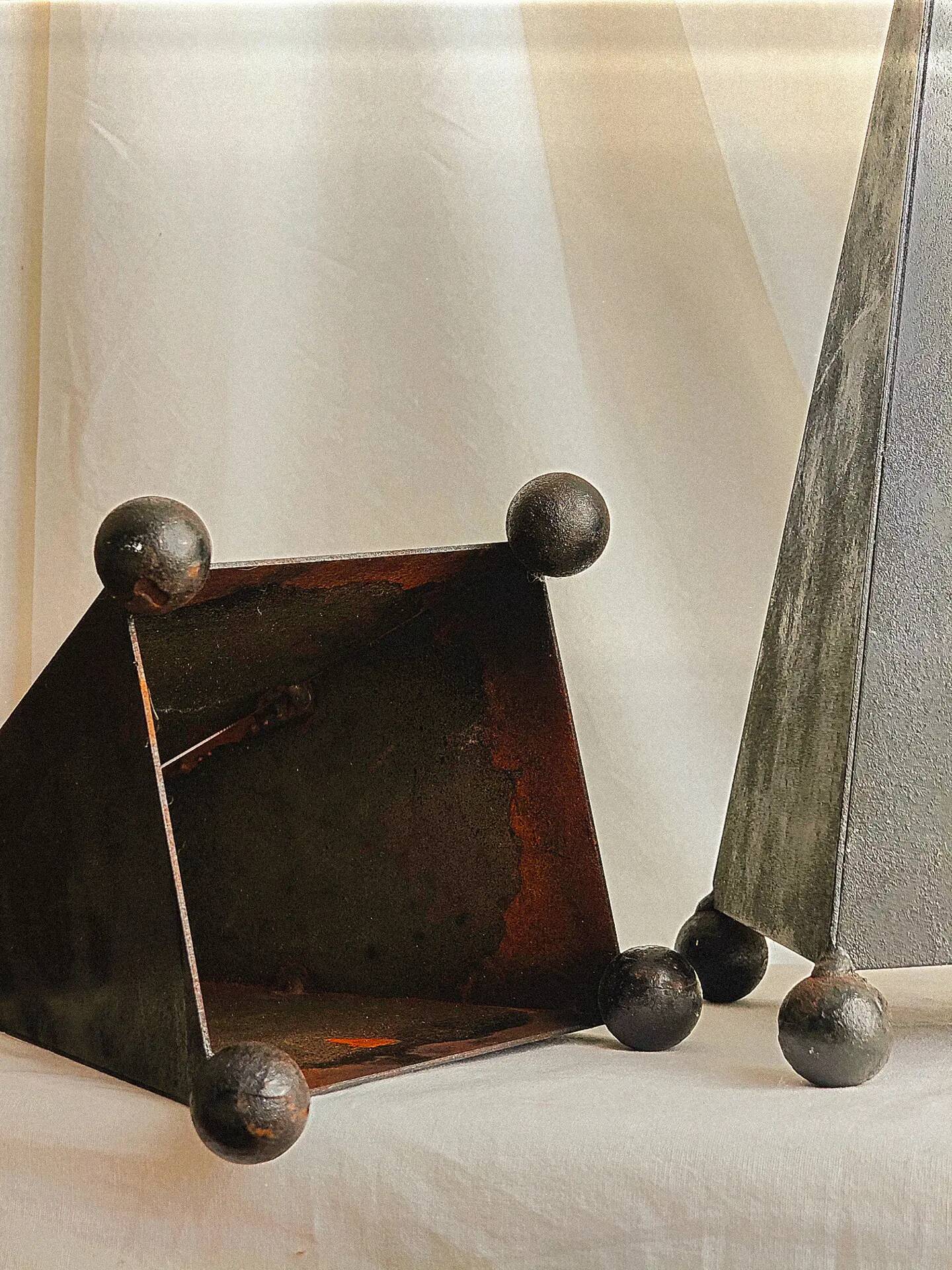 Pair of pyramid-shaped candlesticks in blackened metal (brutalism)