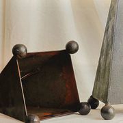 Pair of pyramid-shaped candlesticks in blackened metal (brutalism)