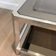 Pair of octagonal chrome side tables with tinted glass tops