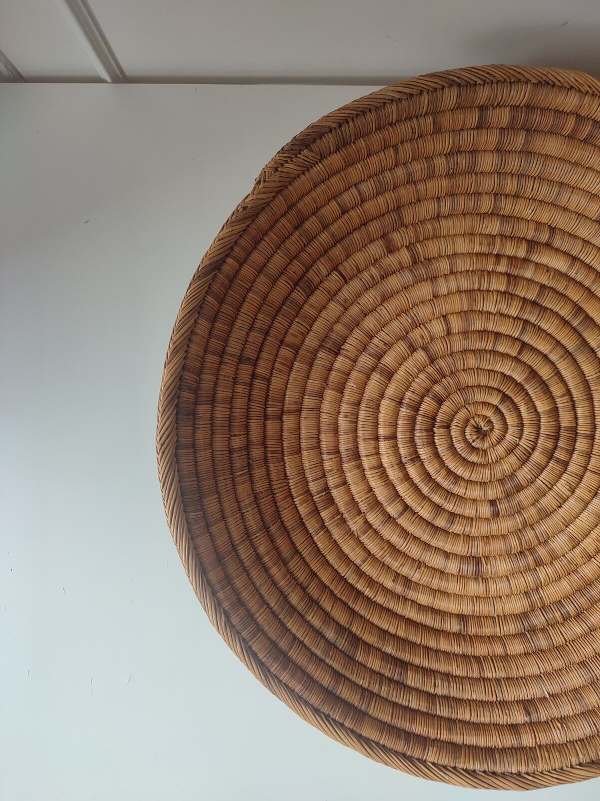Ethnic plateau in woven palm leaf