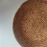 Ethnic plateau in woven palm leaf