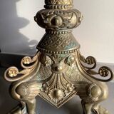 Large bronze candlestick with tripod and winged dog decoration, 19th century.