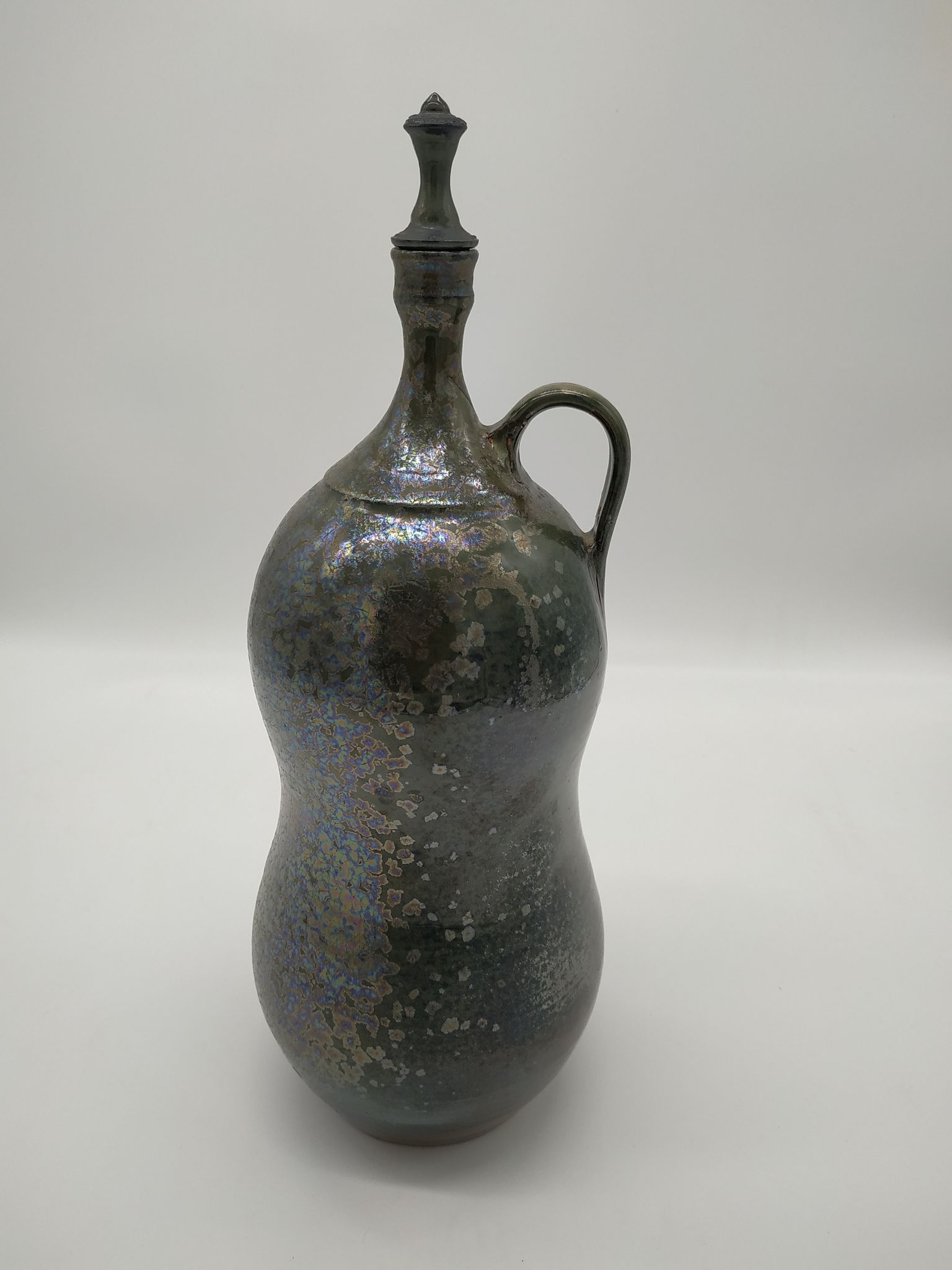 Bottle in iridescent green sandstone from the ceramist jean aimé Poirier
