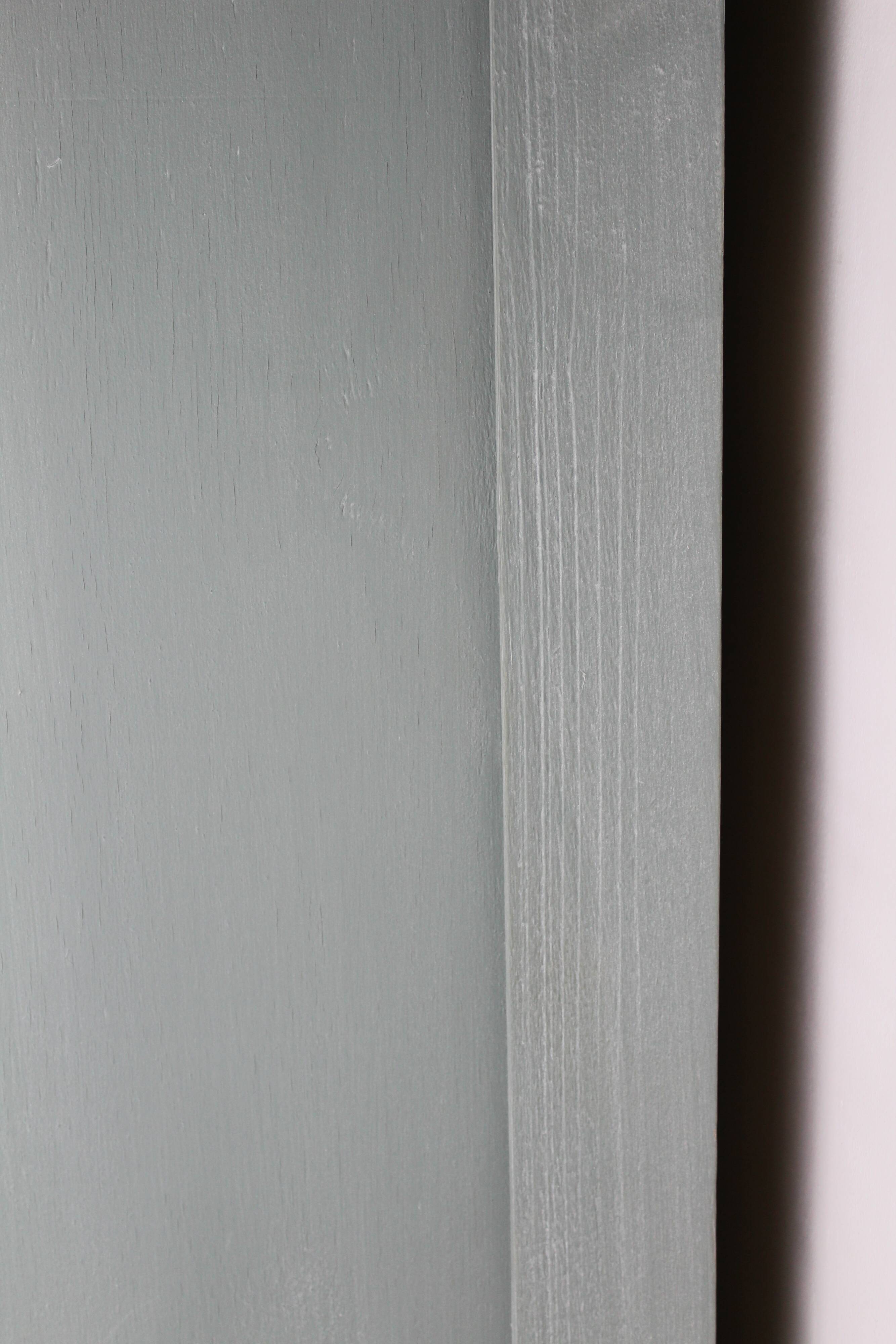 Renovated Parisian wardrobe – sage green with white patina