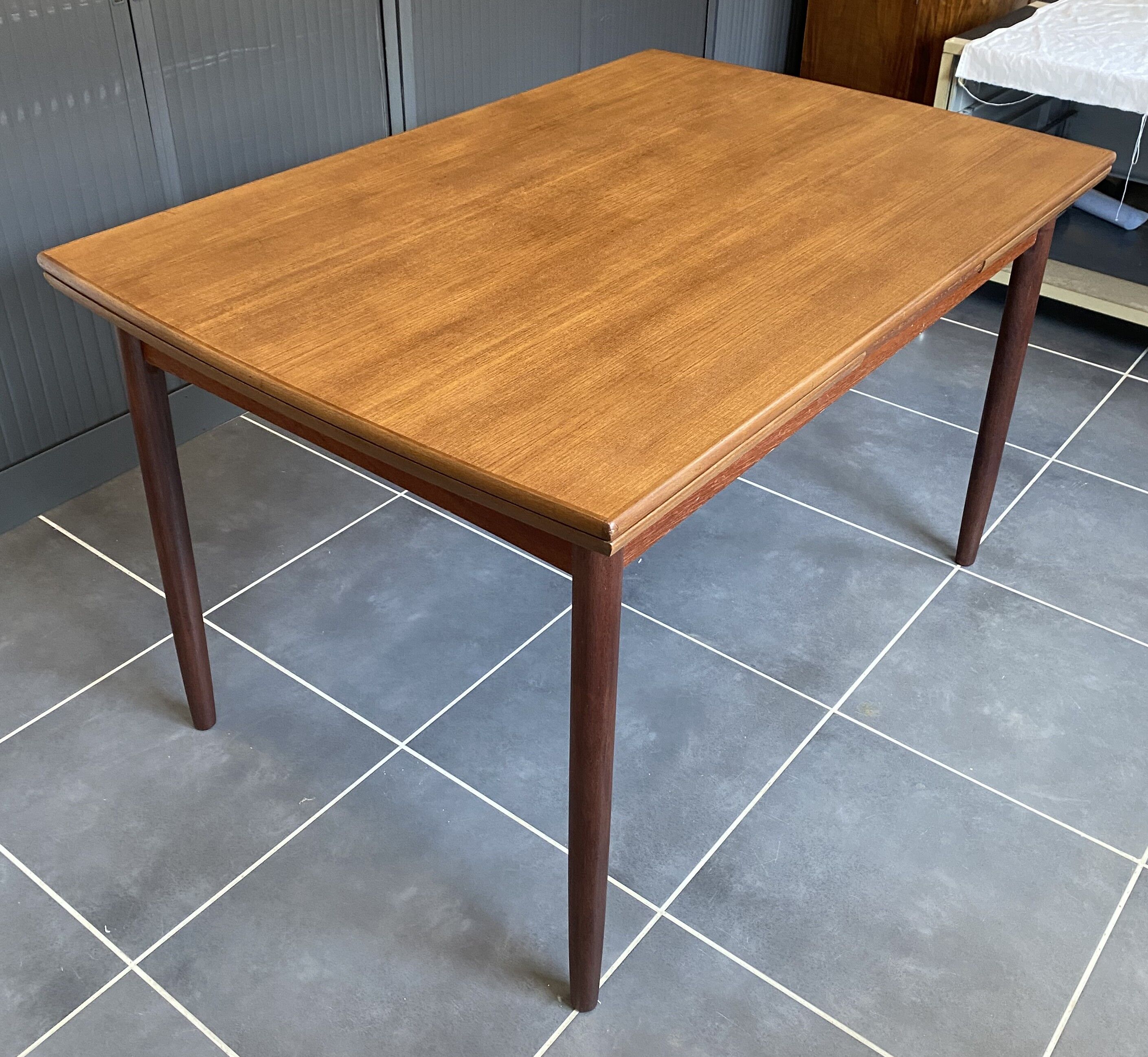 Extendable Scandinavian teak table by Johannes Andersen for Samcom Denmark.