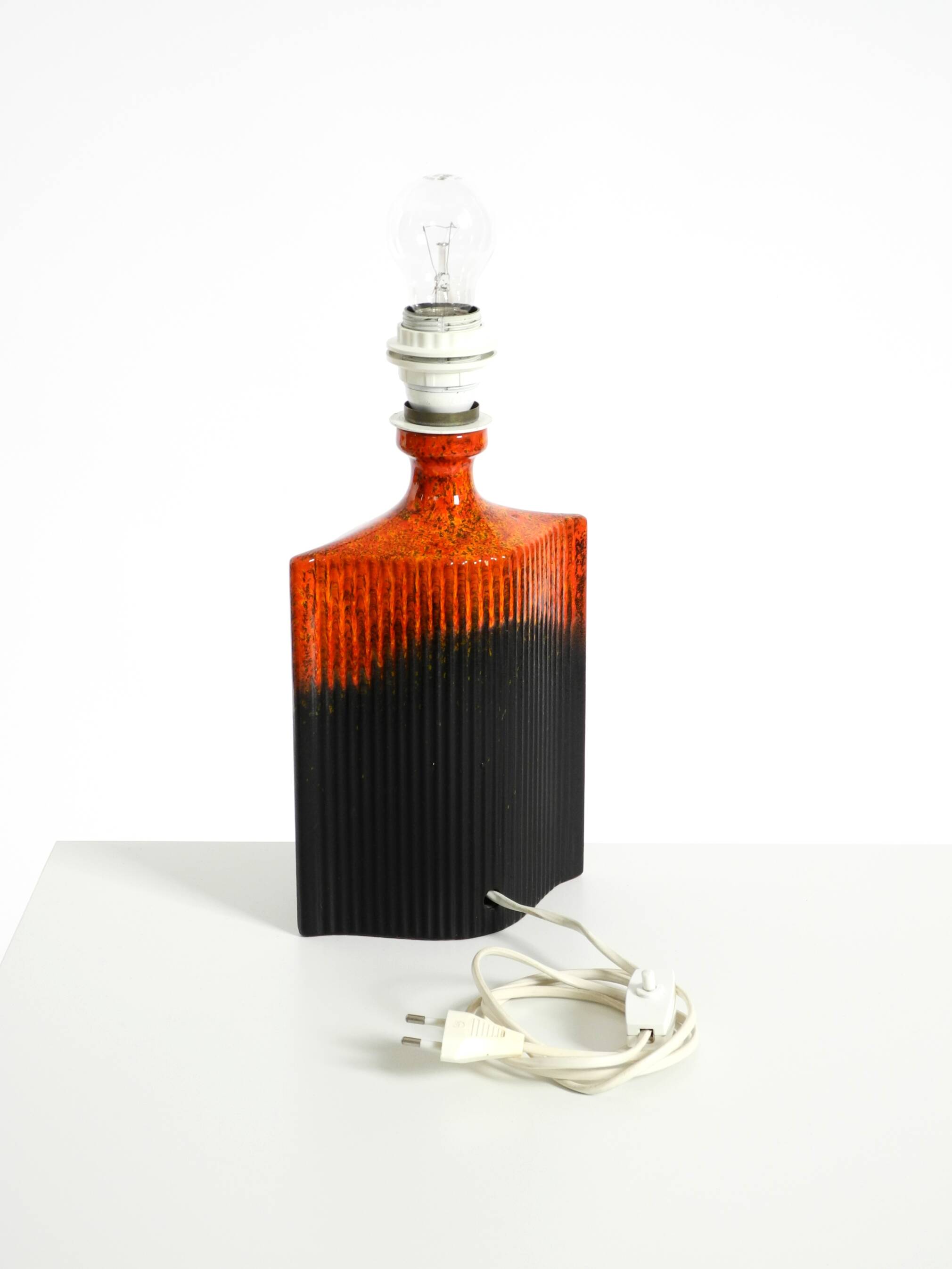 Unique 1960s ceramic table lamp in red and black by Kaiser Leuchten