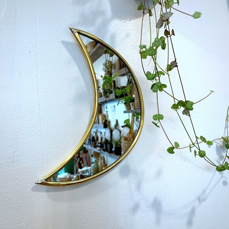 Moon-shaped gilded brass wall mirror, 24x9 cm