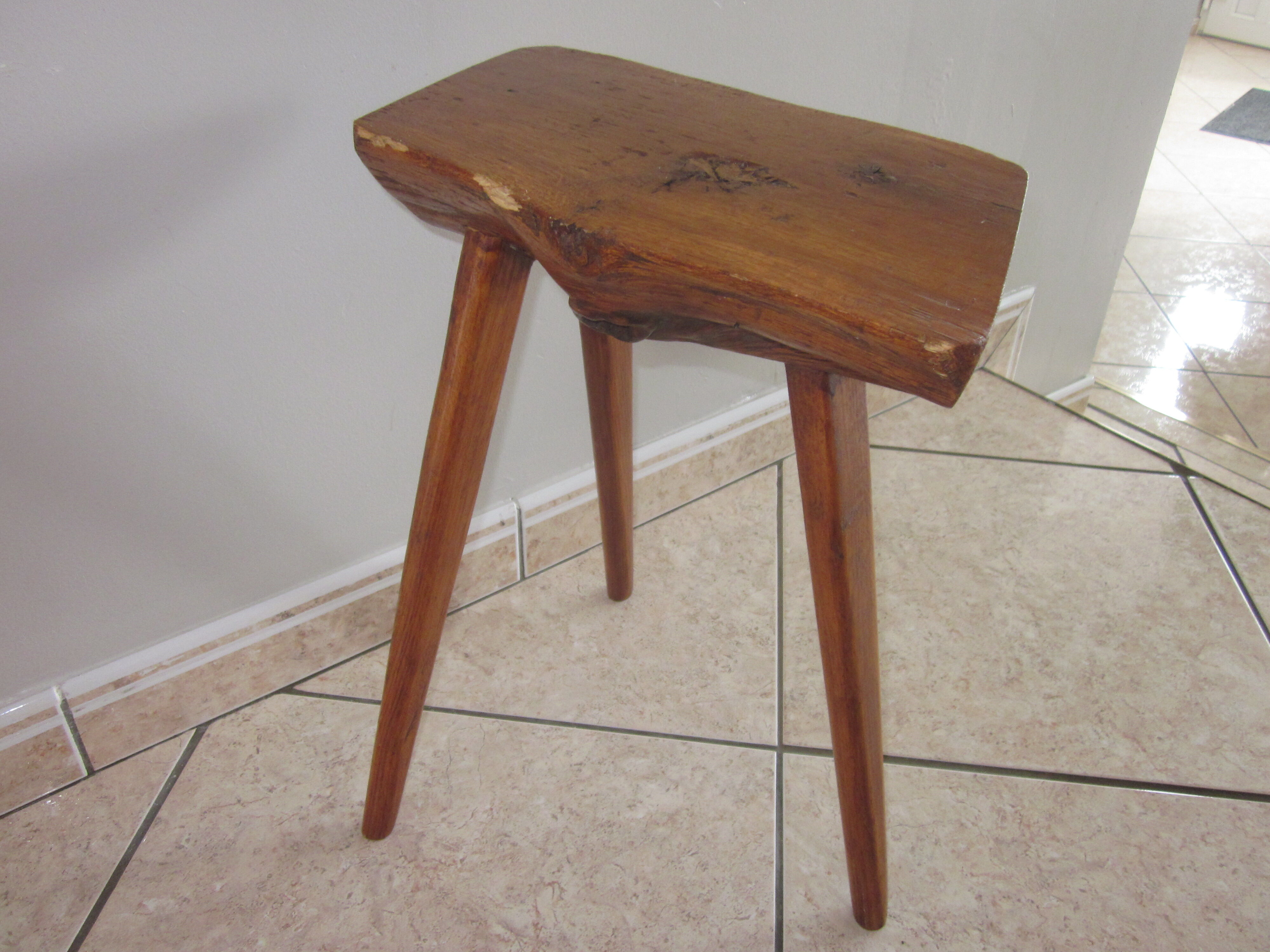 Raw wooden tripod stool