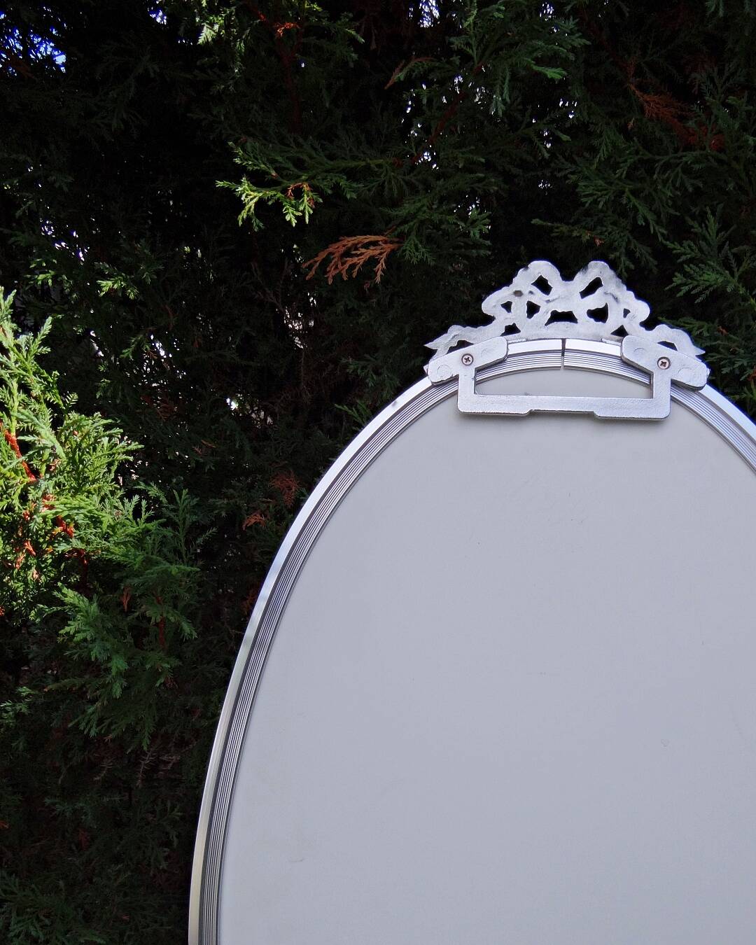 Oval mirror 66x37 Louis XVI style knot in vintage silver metal from the 70s