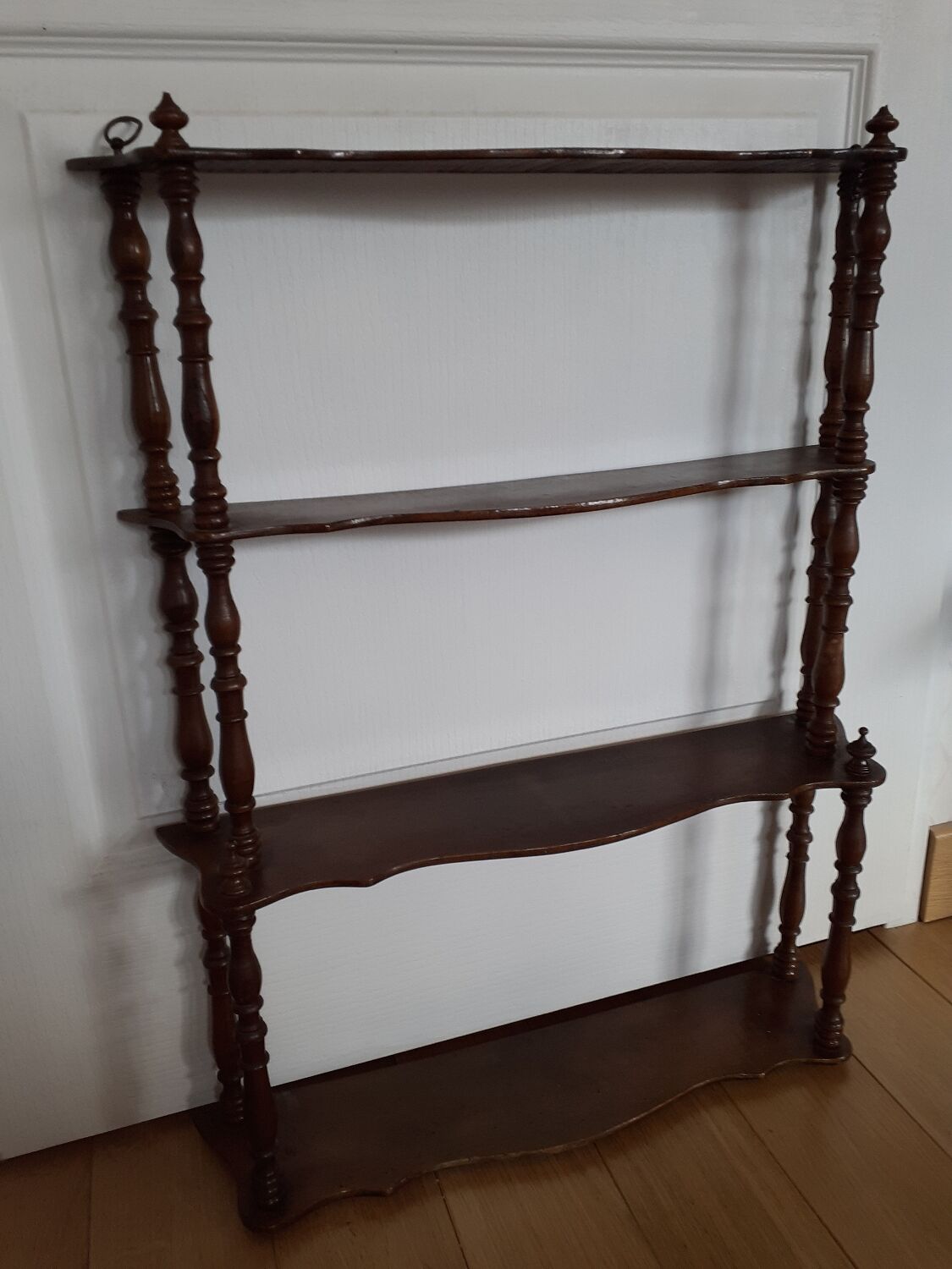 Turned wooden wall shelf