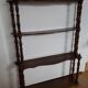 Turned wooden wall shelf