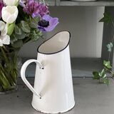 Old white enameled pitcher