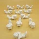 12 porte-couteaux vintage en porcelaine figurant des chérubins