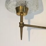 Pair of bronze sconces with worked glass reflectors