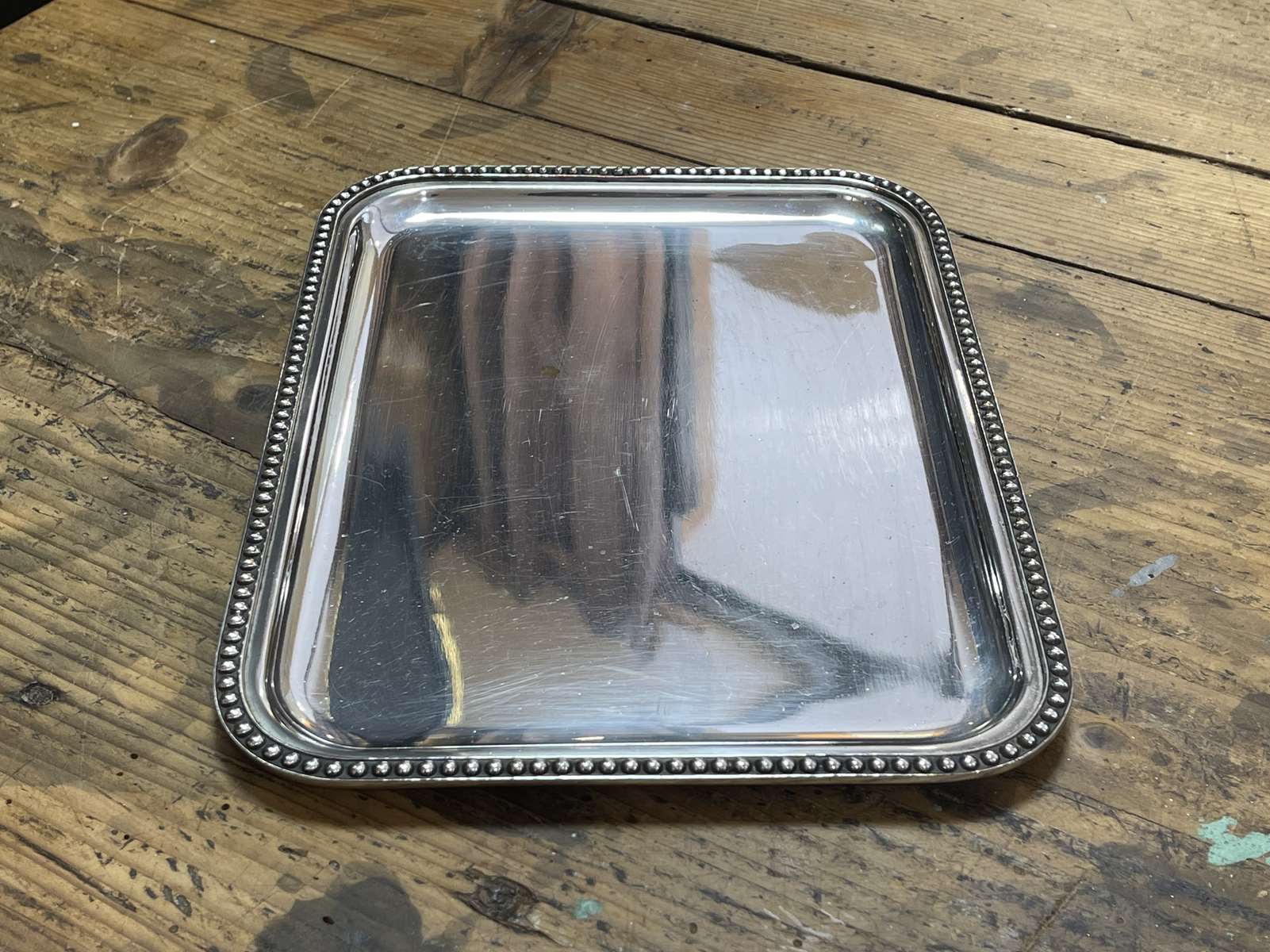 Small rectangular and beaded silver metal top