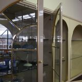 Showcases in lacquered wood, glass and brass  1970s, set of 4