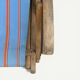 Vintage deck chair with orange and blue striped fabric, original patina.